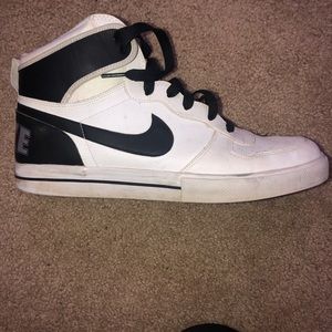 Black and white high top Nike tennis shoes